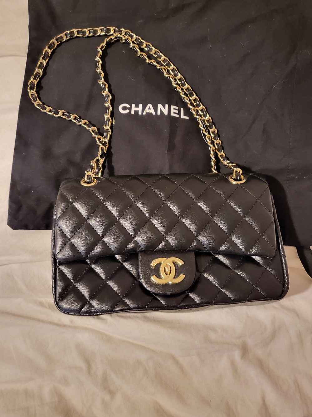CHANEL Quilted Leather Flap Bag in Black with Gold Hardware